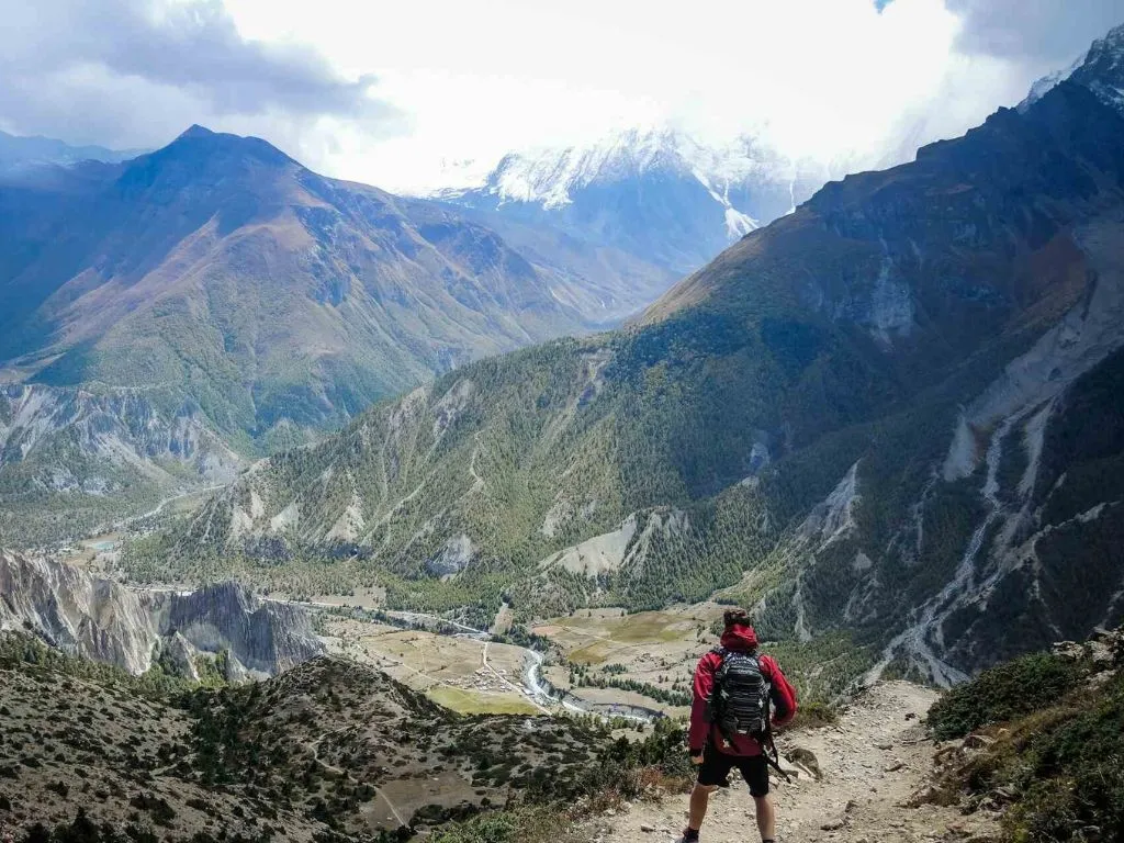 trekker hiking in the Himalayan Nepal avoiding the risk of altitude sickness.