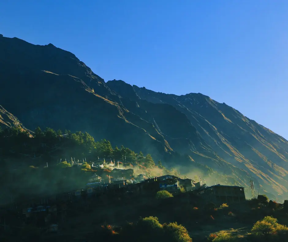 green landscape with blue sky witnessed from lower pisang at annapurna circuit trekking
